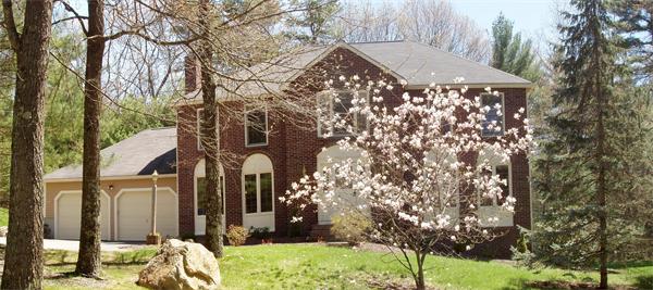 65 Virginia Ridge Road Sudbury, MA 01776 - Photo 1 of 29 a front view of a house with a yard