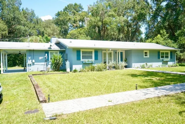 a view of a house with a swimming pool