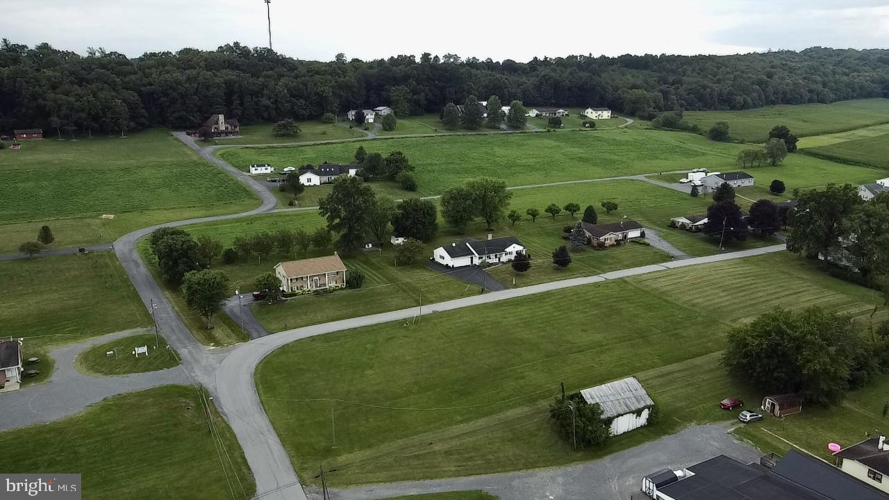 a view of a golf course with chairs
