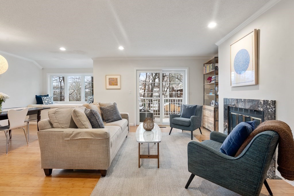160 Pine Street, Unit 27 Newton, MA 02466 - Photo 11 of 30 a living room with fireplace furniture and a large window