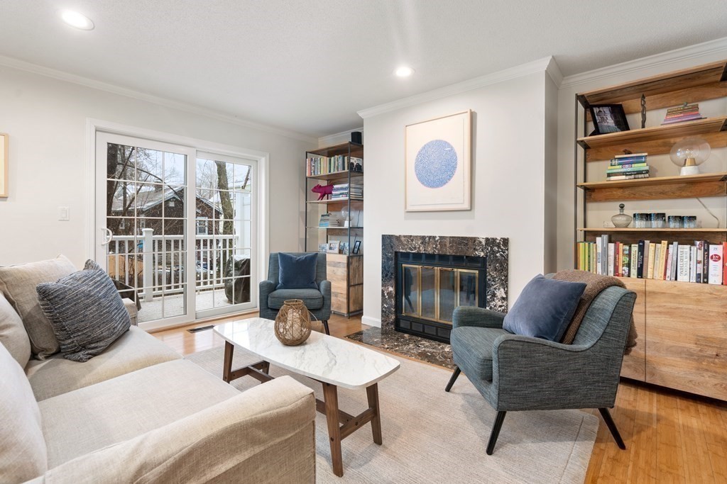 160 Pine Street, Unit 27 Newton, MA 02466 - Photo 12 of 30 a living room with furniture and a fireplace