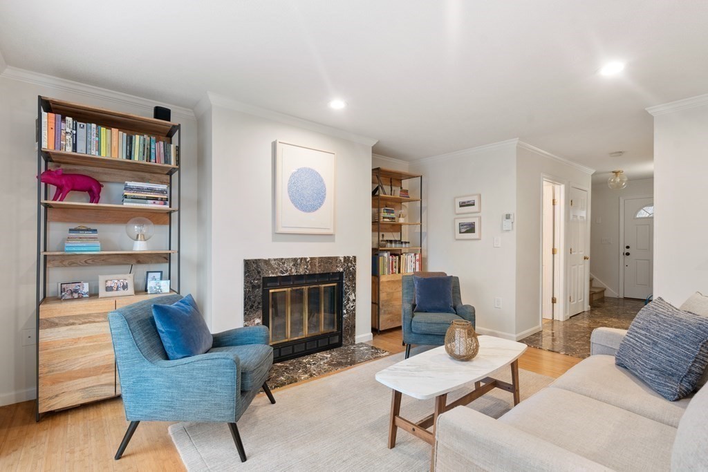 160 Pine Street, Unit 27 Newton, MA 02466 - Photo 13 of 30 a living room with furniture and a fireplace