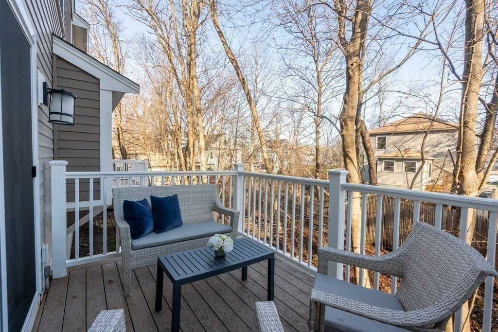 160 Pine Street, Unit 27 Newton, MA 02466 - Photo 15 of 30 a view of a house with wooden deck and furniture