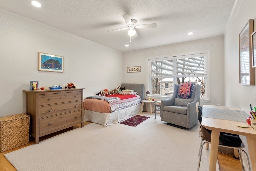 160 Pine Street, Unit 27 Newton, MA 02466 - Photo 21 of 30 a bedroom with a bed and wooden floor