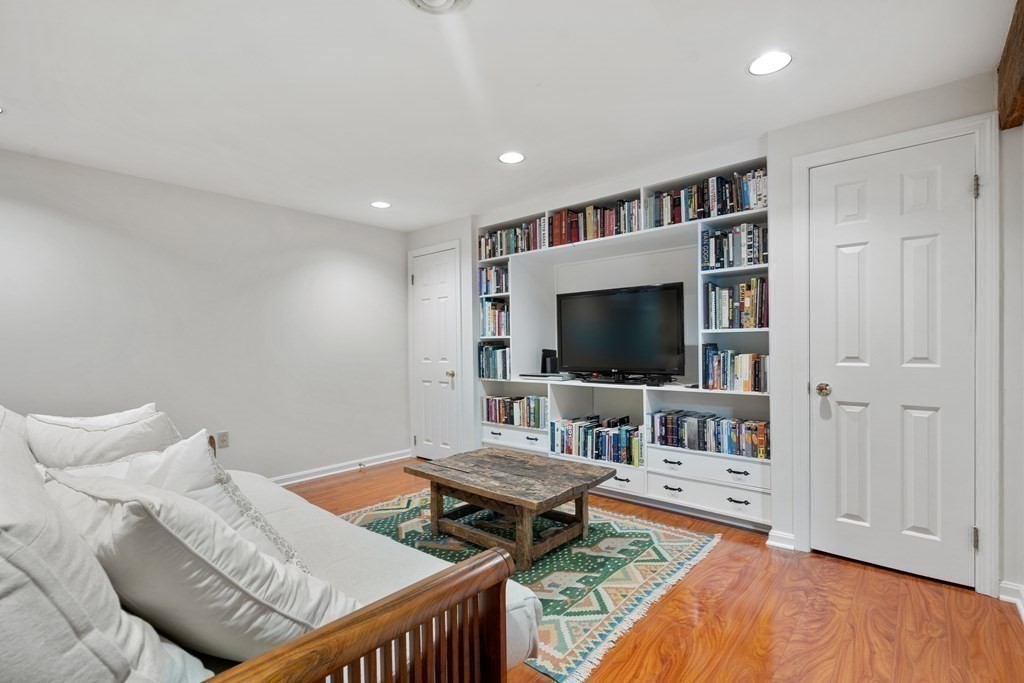160 Pine Street, Unit 27 Newton, MA 02466 - Photo 23 of 30 a living room with furniture and a flat screen tv