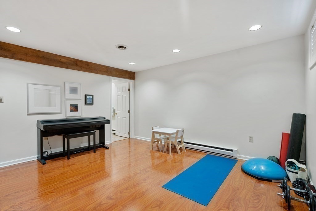 160 Pine Street, Unit 27 Newton, MA 02466 - Photo 25 of 30 a living room with furniture and a wooden floor