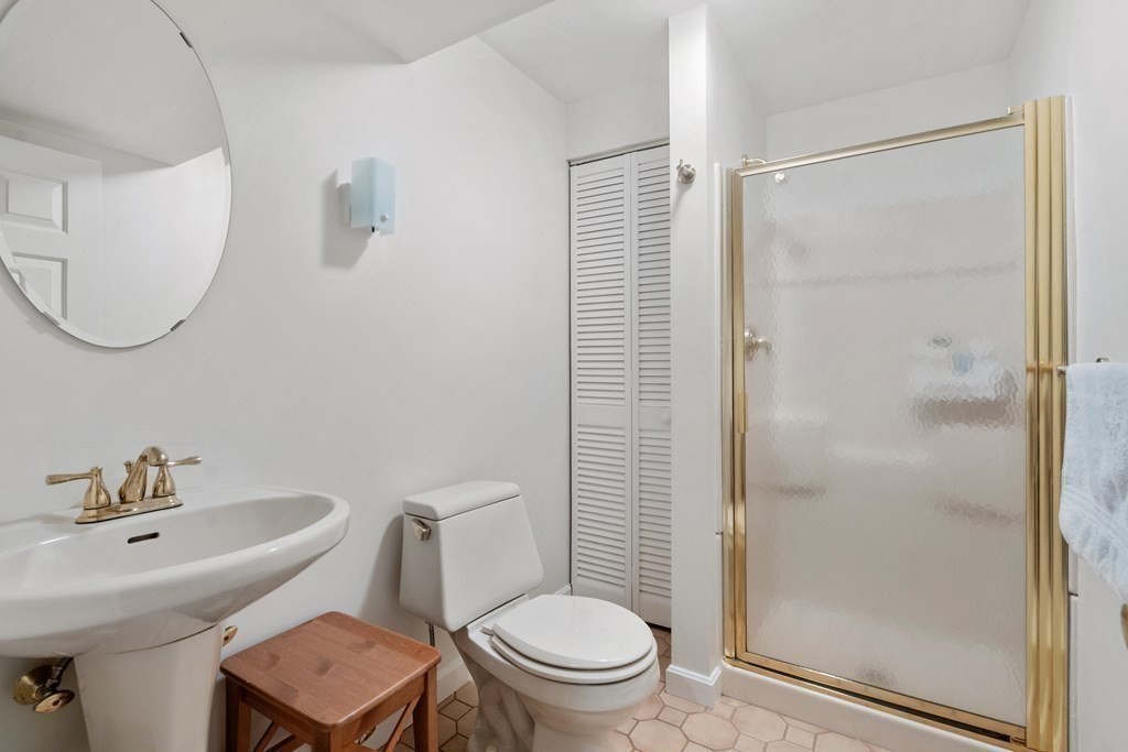 160 Pine Street, Unit 27 Newton, MA 02466 - Photo 26 of 30 a bathroom with a sink toilet and shower