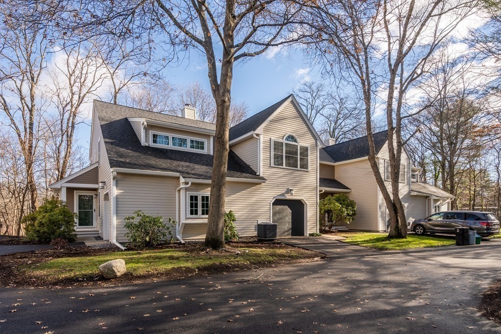 160 Pine Street, Unit 27 Newton, MA 02466 - Photo 3 of 30 a view of a white house with a large tree in front