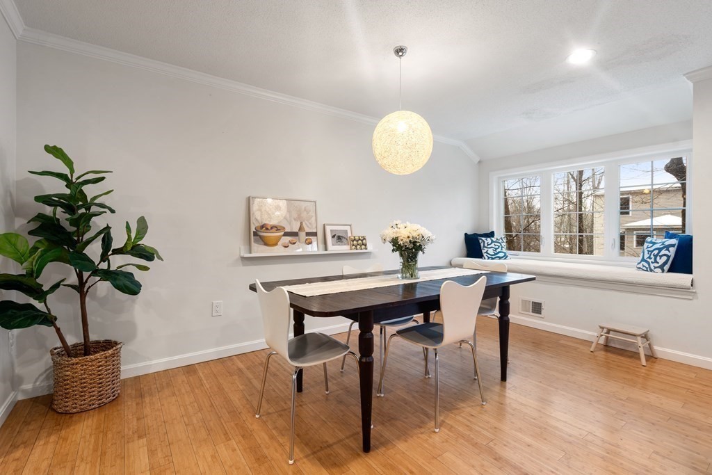 160 Pine Street, Unit 27 Newton, MA 02466 - Photo 8 of 30 a view of a dining room with furniture and a potted plant