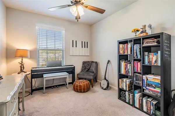 a bedroom with furniture and a book shelf