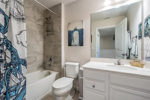 a bathroom with a sink a toilet and a bathtub