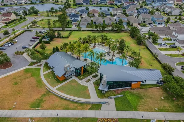 an aerial view of a house with a garden and yard