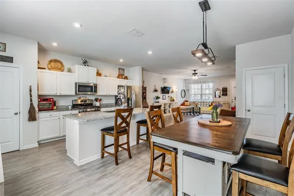 a view of kitchen with sink and wooden floor