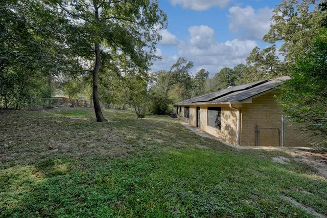 a backyard of a house with lots of green space