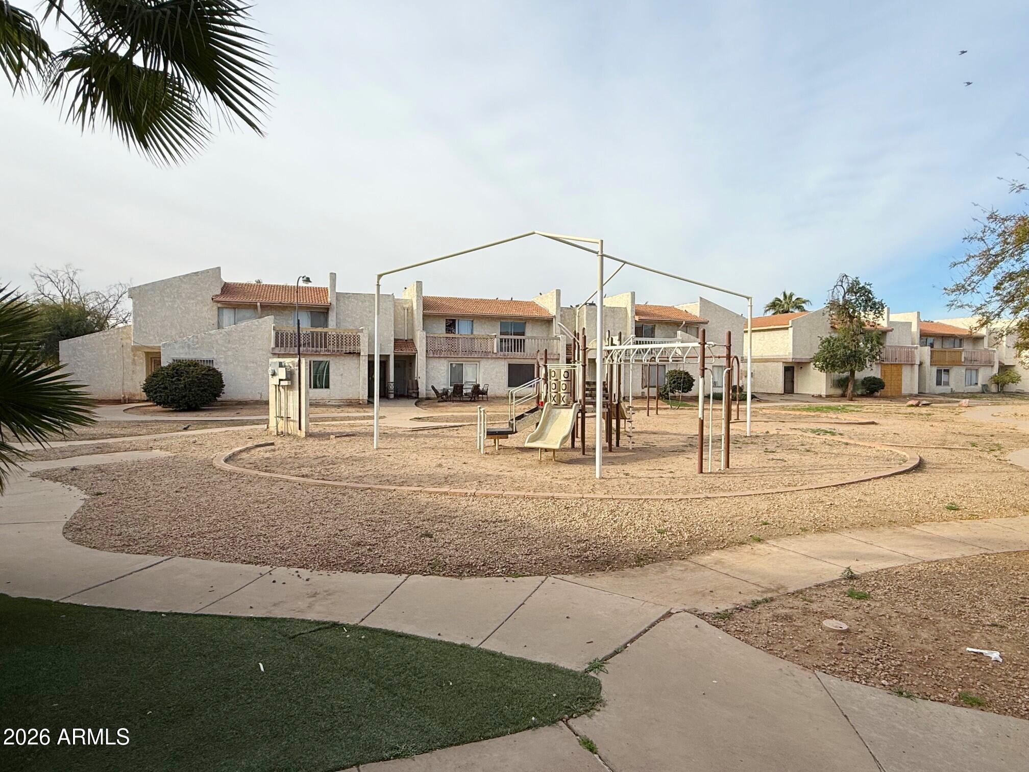 3840 North 43rd Avenue, Unit 34 Phoenix, AZ 85031 - Photo 17 of 18 a view of a house with a entertaining space
