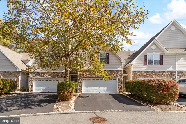 a front view of a house with parking