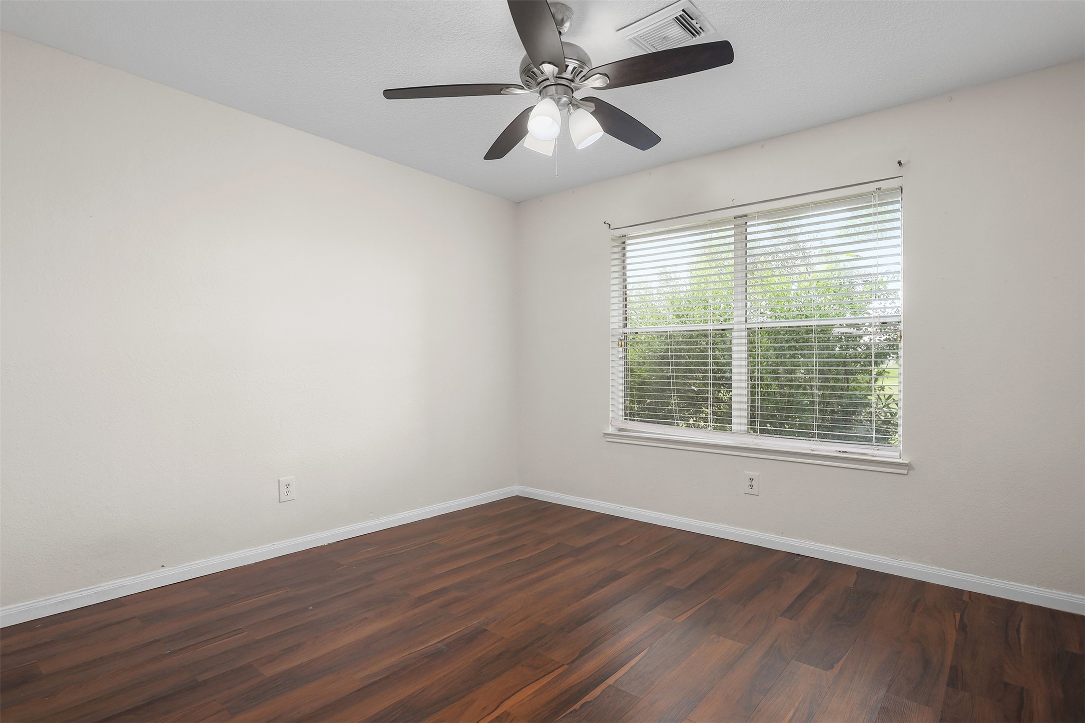 1333 Highway 36 Rosenberg, TX 77471 - Photo 21 of 40 a view of an empty room with wooden floor and a window