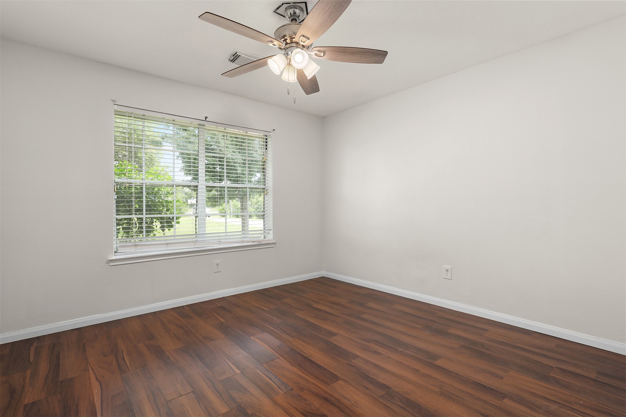 1333 Highway 36 Rosenberg, TX 77471 - Photo 24 of 40 a view of empty room with wooden floor and fan