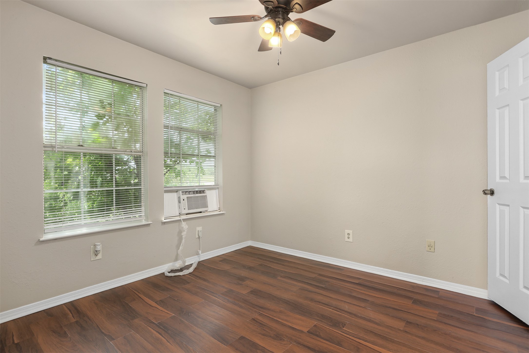 1333 Highway 36 Rosenberg, TX 77471 - Photo 35 of 40 a view of an empty room with wooden floor and a window