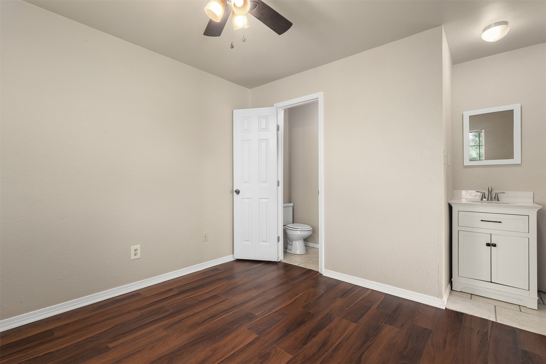 1333 Highway 36 Rosenberg, TX 77471 - Photo 36 of 40 an empty room with wooden floor and windows