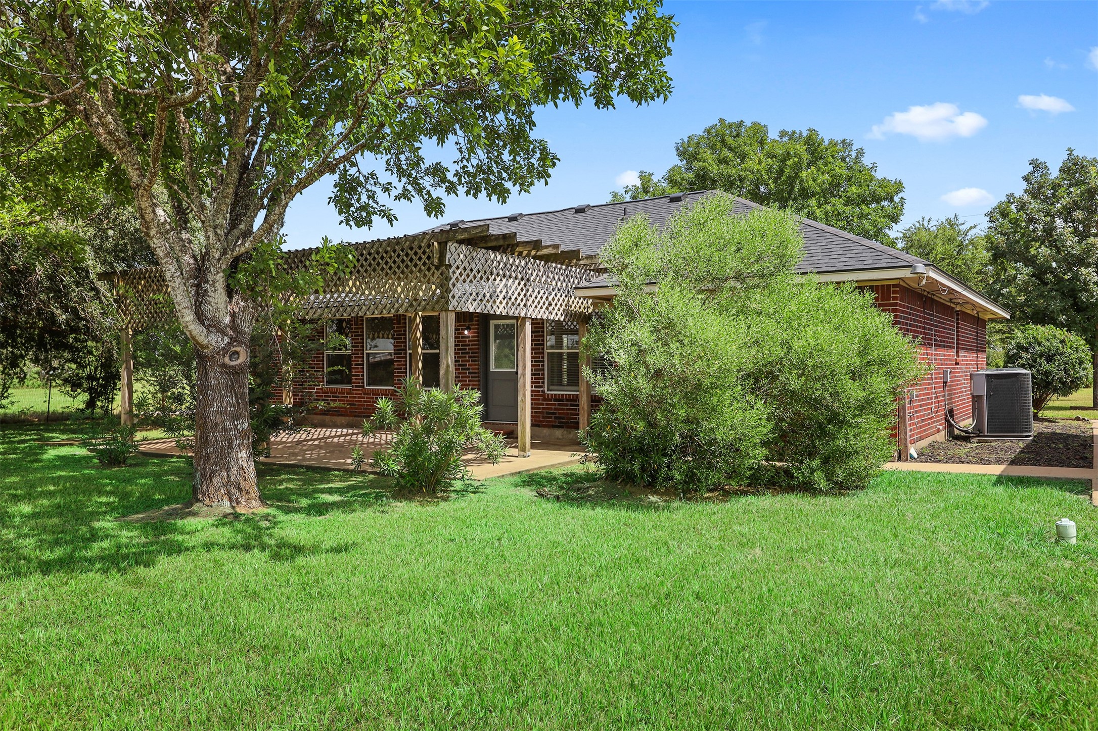 1333 Highway 36 Rosenberg, TX 77471 - Photo 7 of 40 a view of a house with a yard and tree
