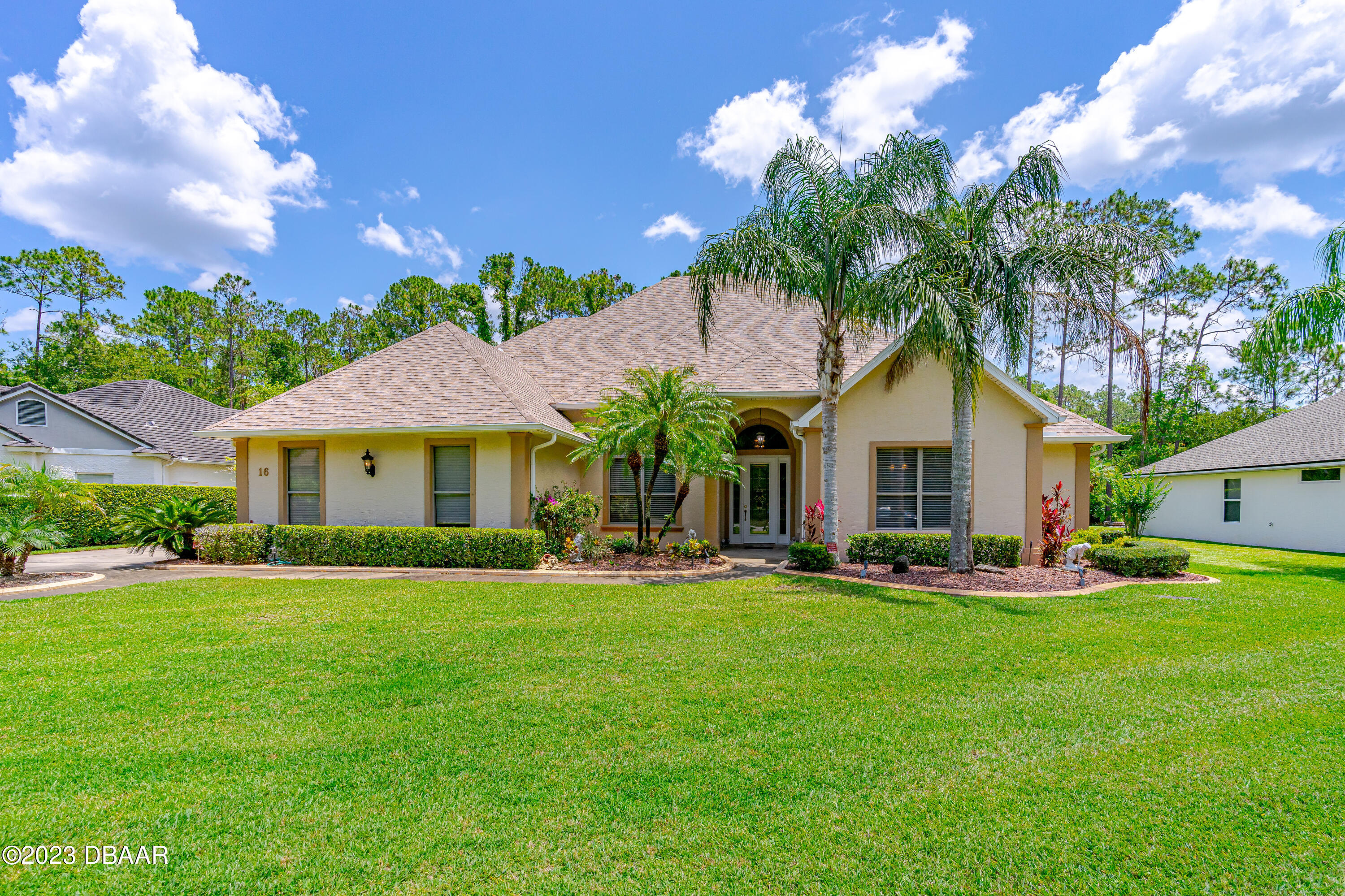 16 Foxcroft Ormond Beach Ormond Beach, FL 32174 - Photo 1 of 54 a front view of a house with a yard and trees