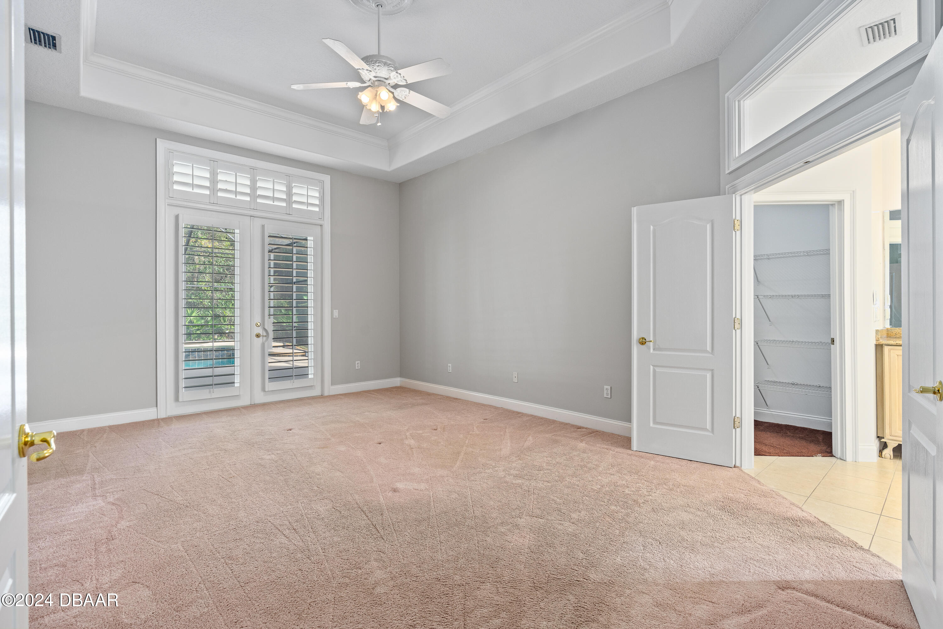 16 Foxcroft Ormond Beach Ormond Beach, FL 32174 - Photo 15 of 54 an empty room with windows and fan