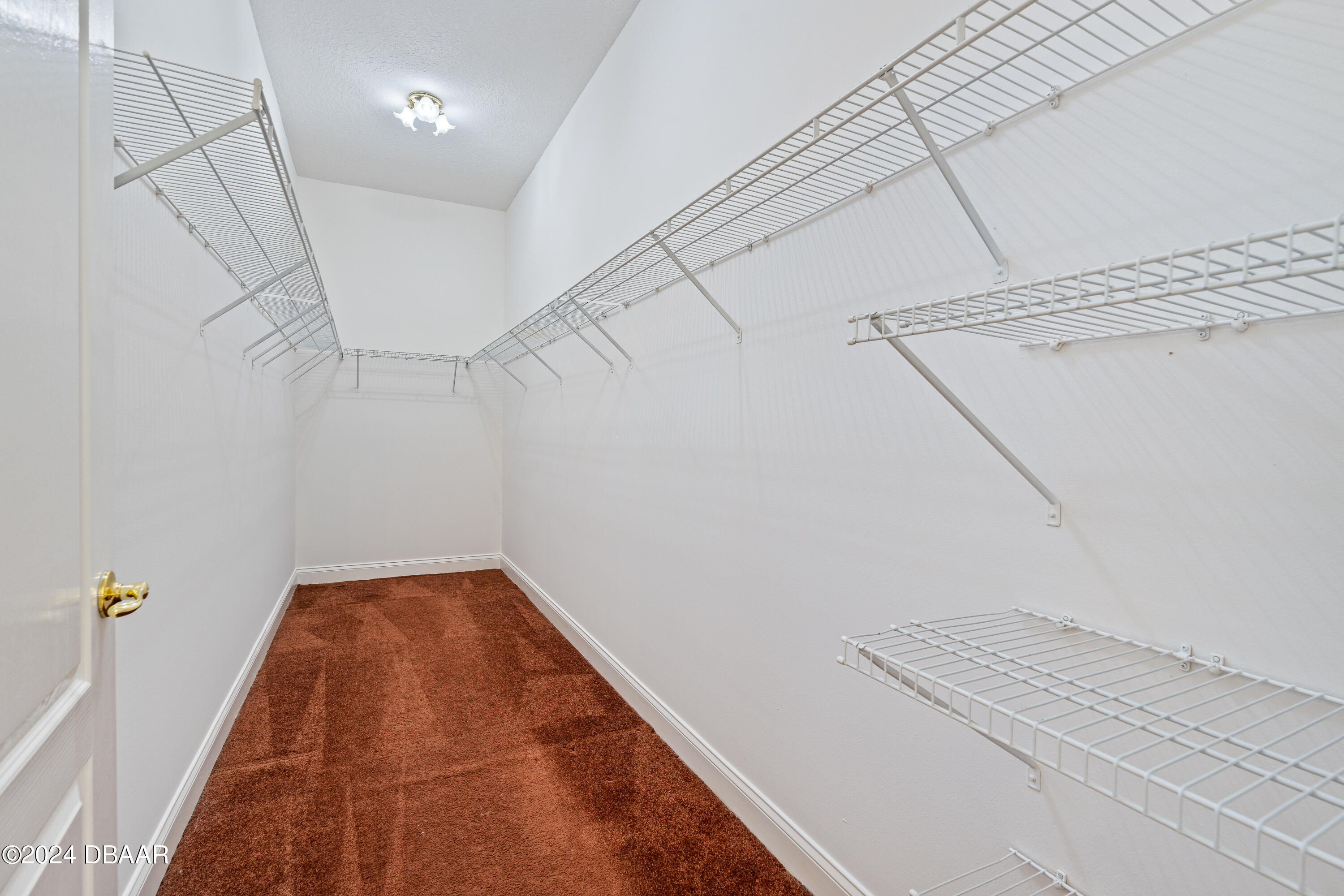 16 Foxcroft Ormond Beach Ormond Beach, FL 32174 - Photo 20 of 54 a view of a room with racks on the wall