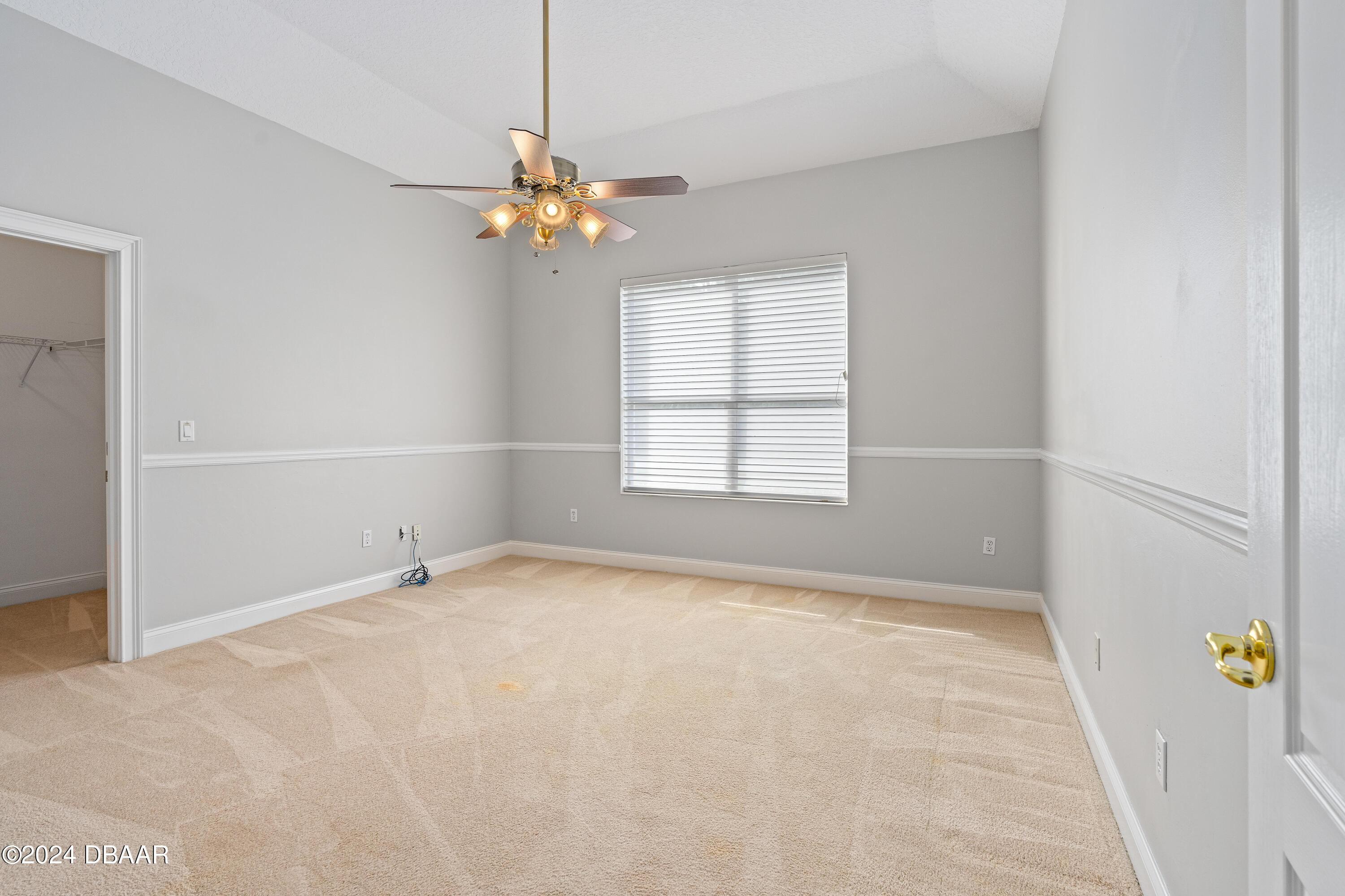 16 Foxcroft Ormond Beach Ormond Beach, FL 32174 - Photo 21 of 54 an empty room with windows and fan