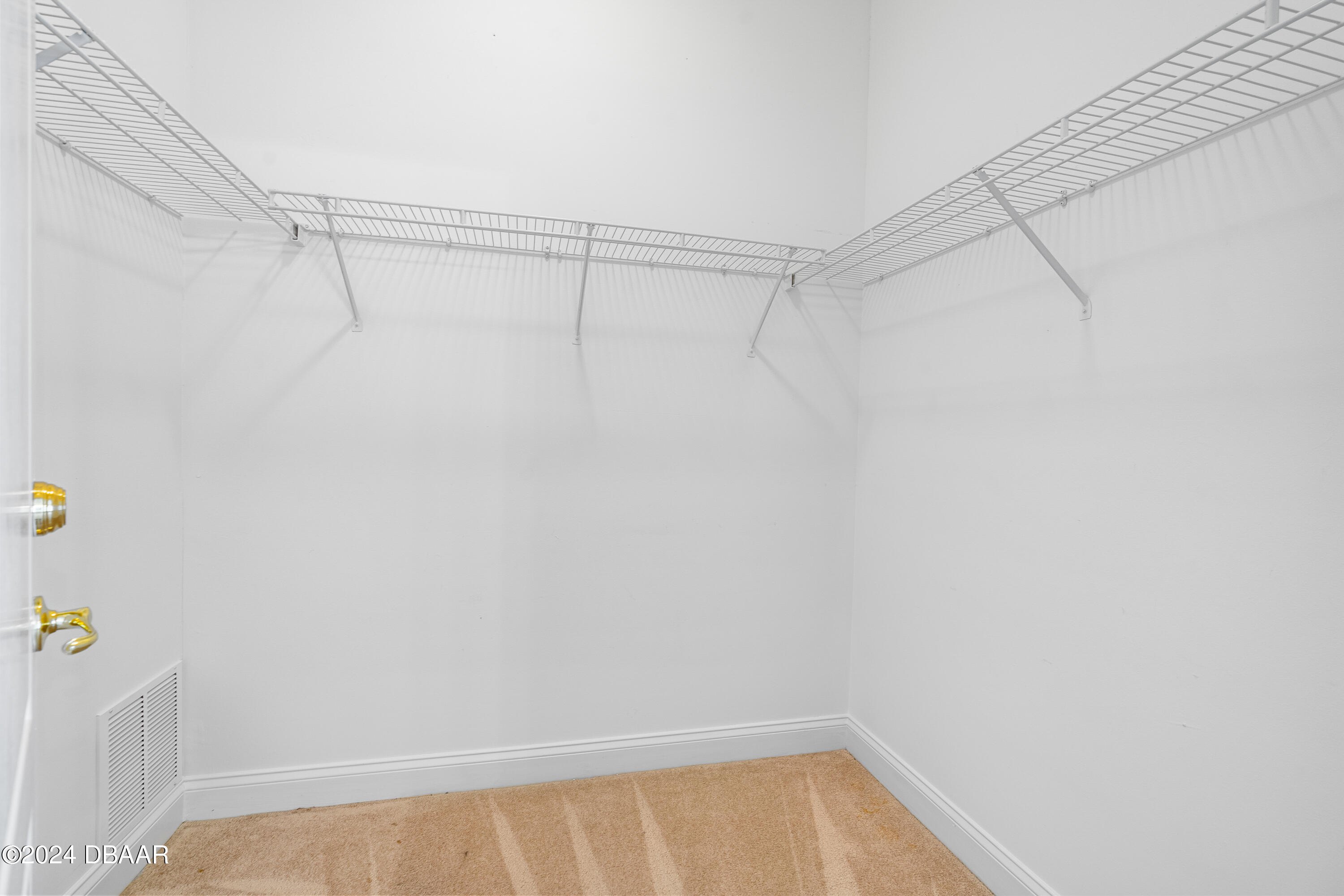 16 Foxcroft Ormond Beach Ormond Beach, FL 32174 - Photo 23 of 54 a view of a room with racks on the wall