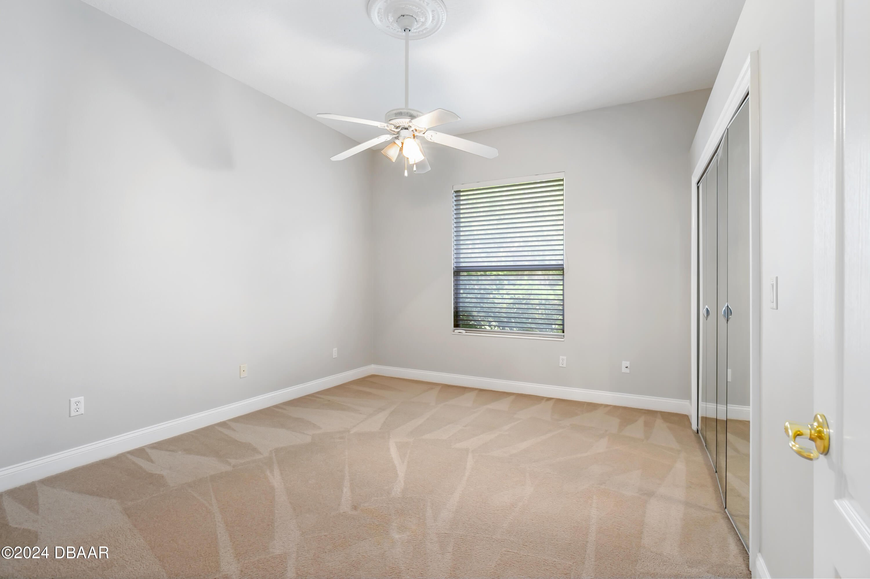 16 Foxcroft Ormond Beach Ormond Beach, FL 32174 - Photo 24 of 54 an empty room with windows and fan