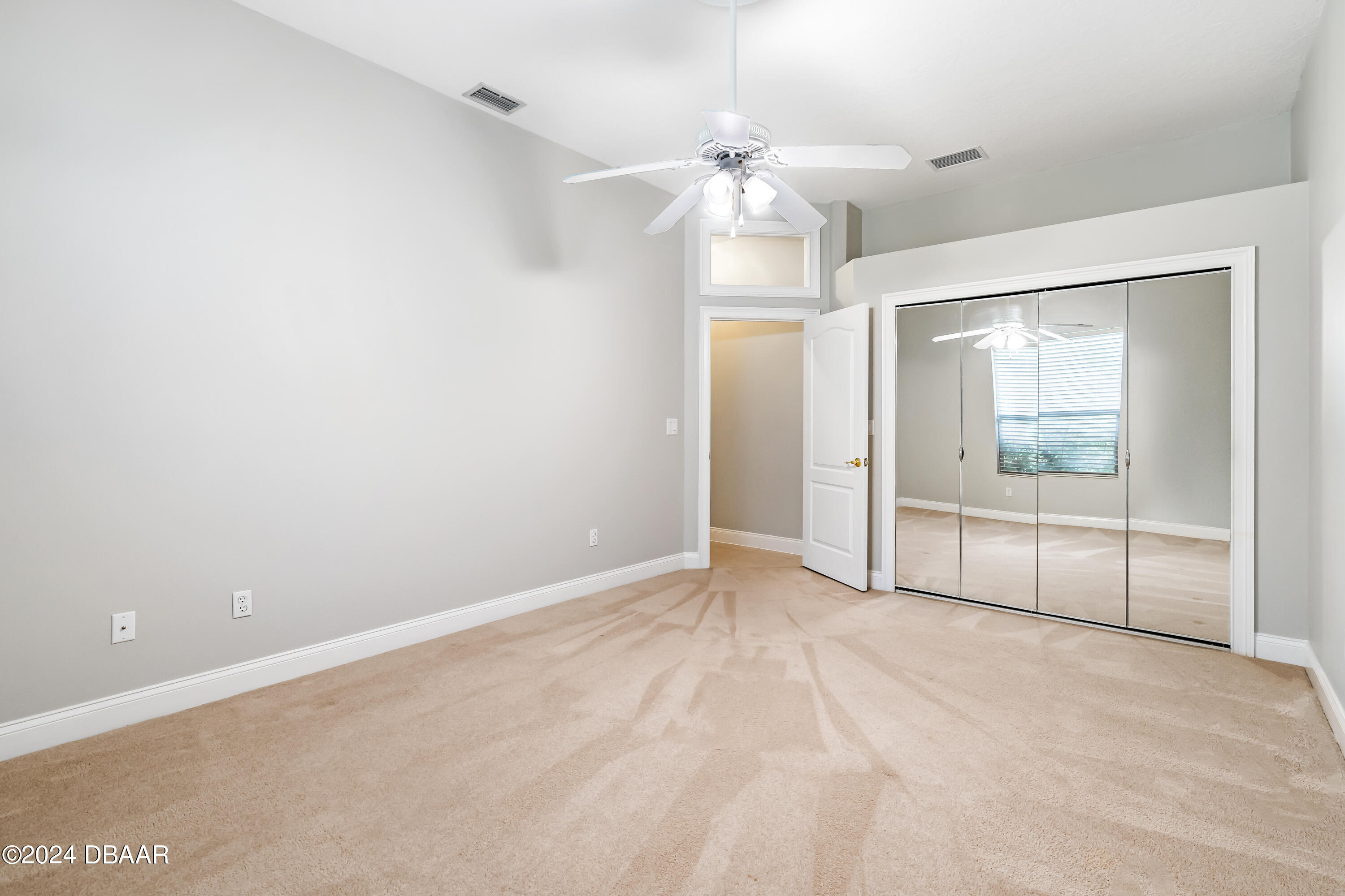 16 Foxcroft Ormond Beach Ormond Beach, FL 32174 - Photo 27 of 54 a view of an empty room with a window