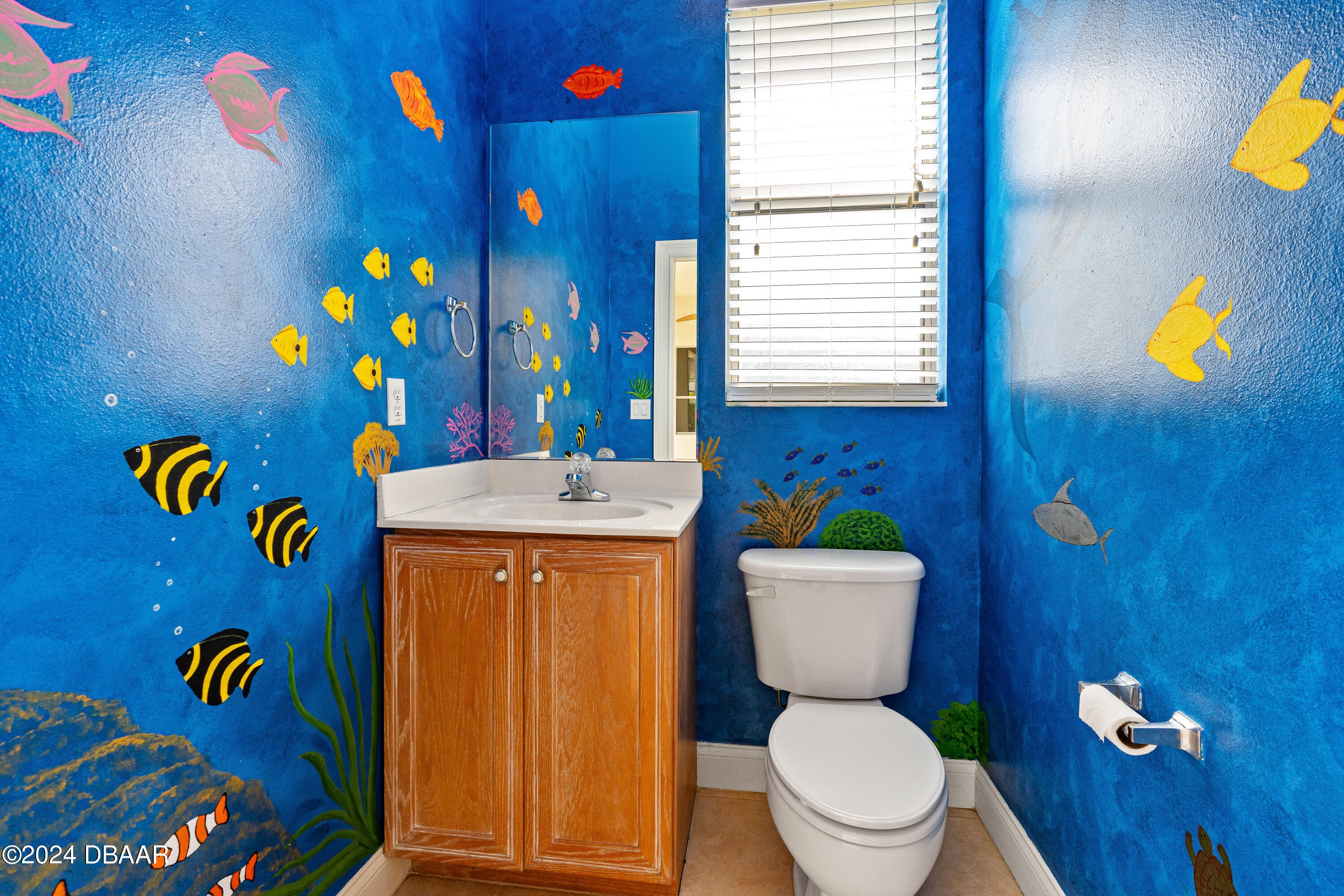16 Foxcroft Ormond Beach Ormond Beach, FL 32174 - Photo 29 of 54 a bathroom with a toilet sink and mirror