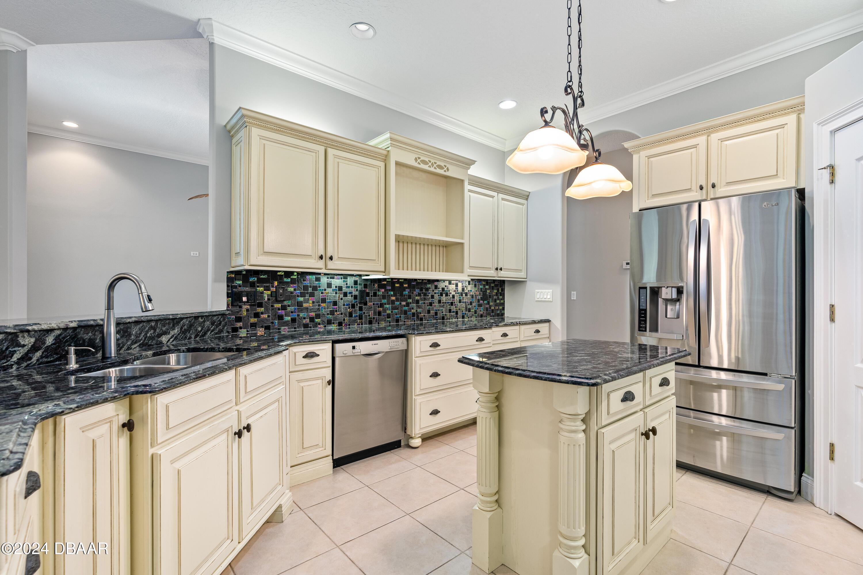 16 Foxcroft Ormond Beach Ormond Beach, FL 32174 - Photo 3 of 54 a kitchen with granite countertop a sink stainless steel appliances and cabinets
