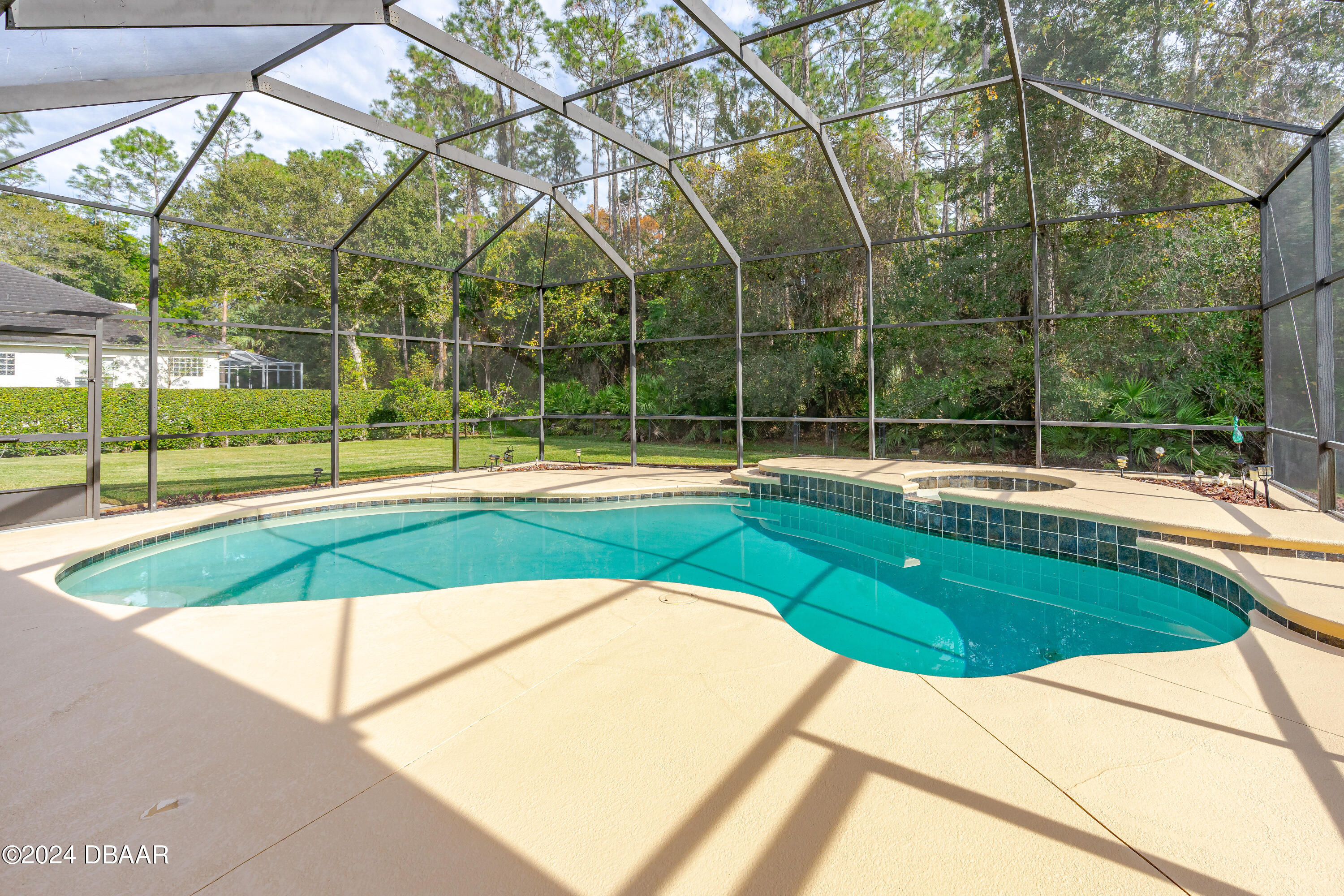 16 Foxcroft Ormond Beach Ormond Beach, FL 32174 - Photo 32 of 54 a view of a swimming pool with a backyard