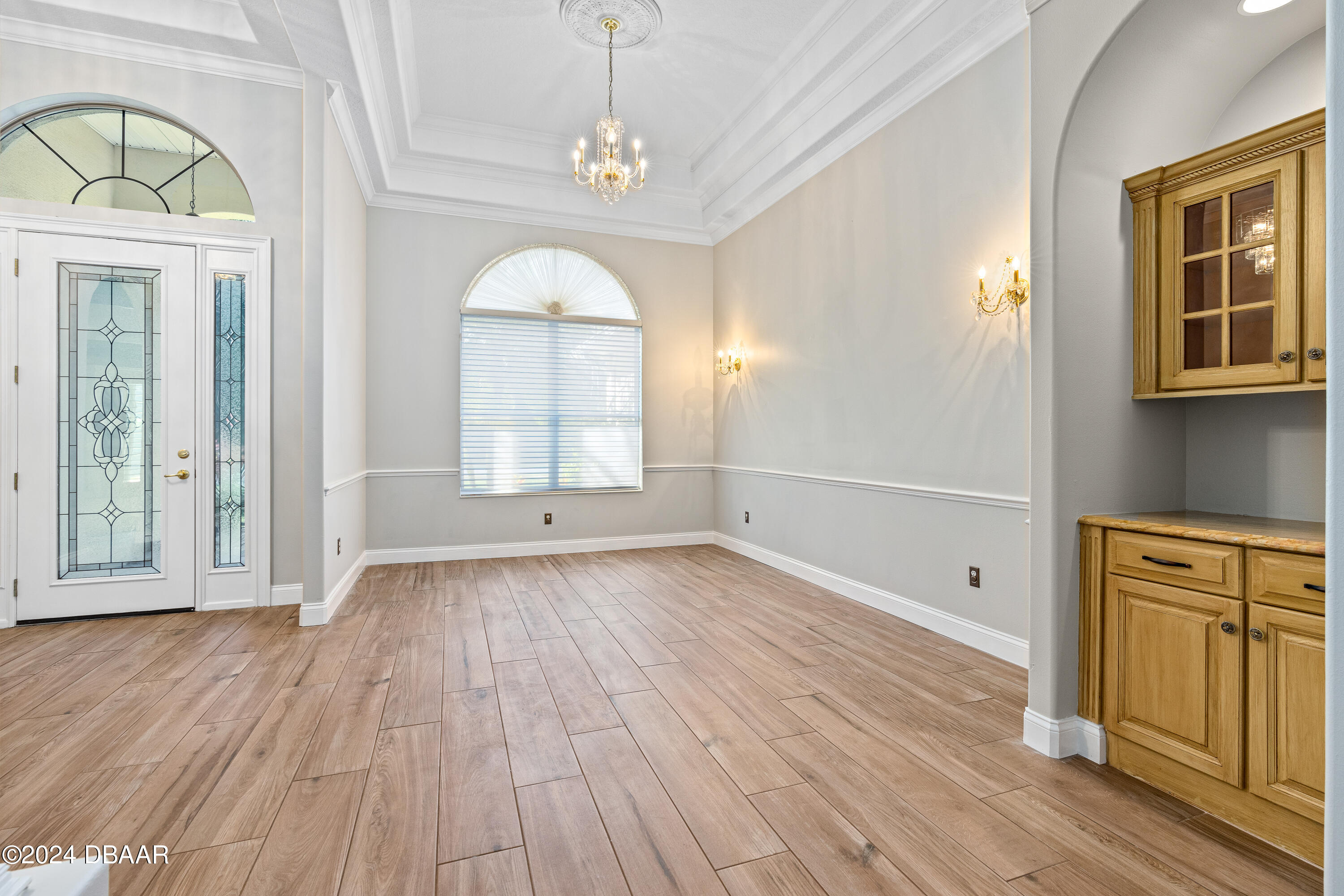 16 Foxcroft Ormond Beach Ormond Beach, FL 32174 - Photo 8 of 54 a view of empty room with wooden floor and fan