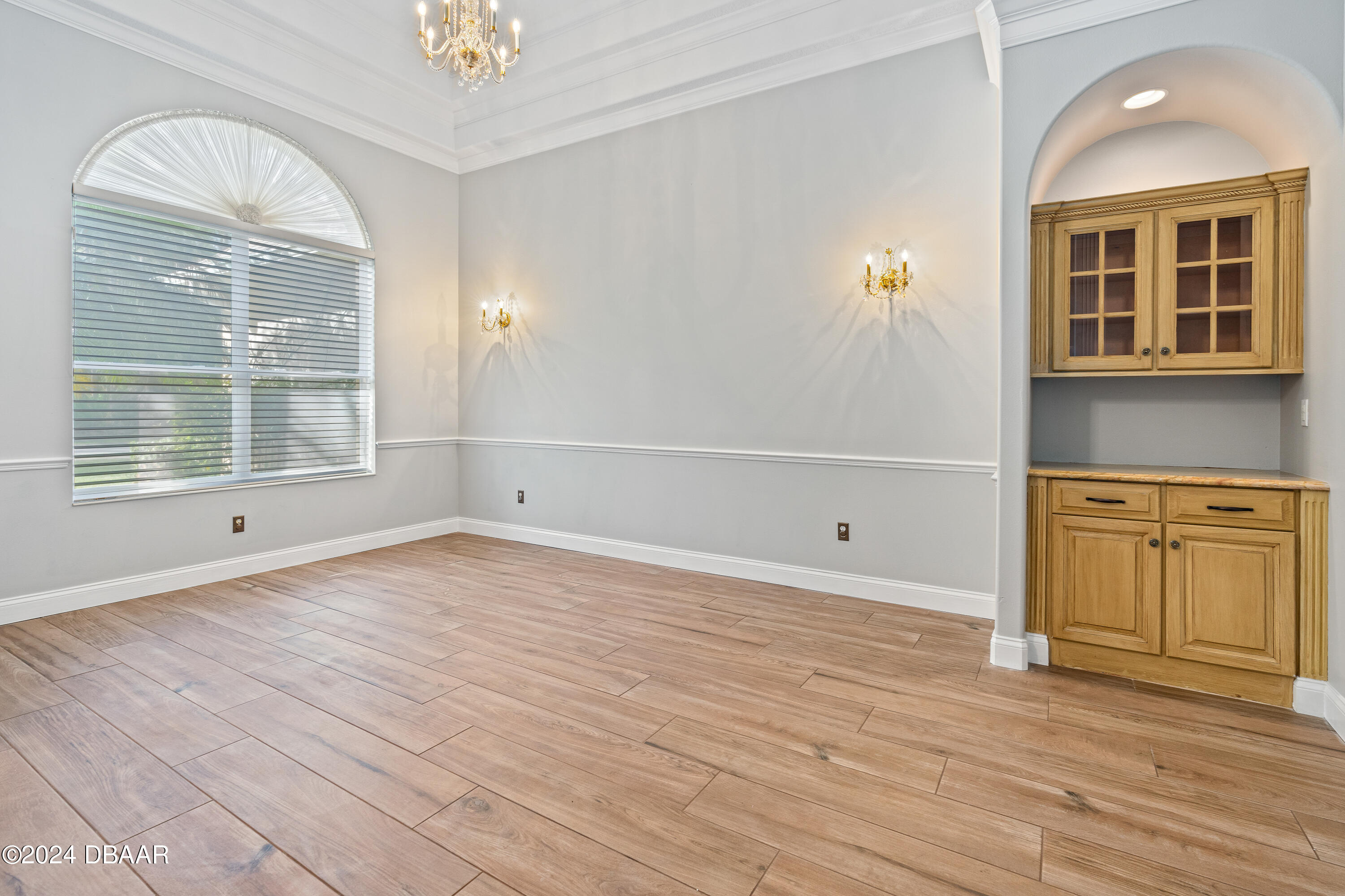 16 Foxcroft Ormond Beach Ormond Beach, FL 32174 - Photo 9 of 54 a view of empty room with wooden floor and fan