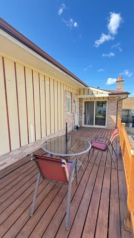 a balcony view with a seating space