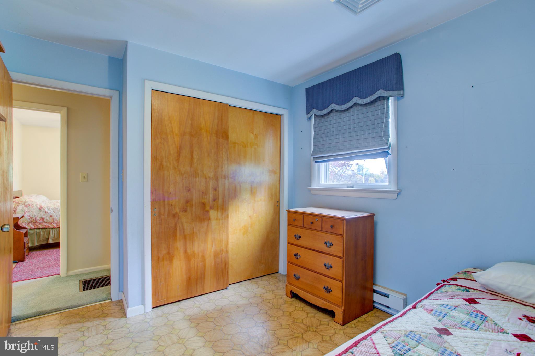 545 Doe Run Road Manheim, PA 17545 - Photo 31 of 47 a bedroom with a bed and a dresser
