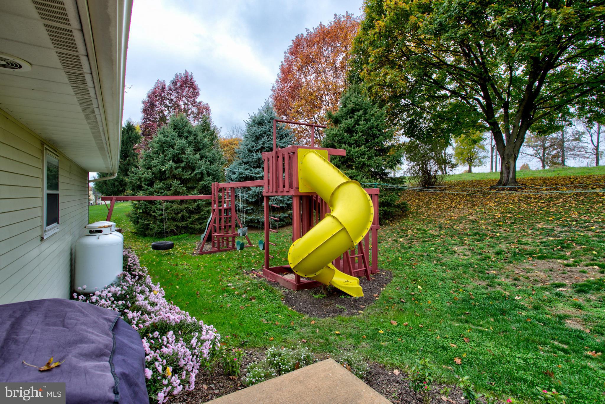 545 Doe Run Road Manheim, PA 17545 - Photo 39 of 47 a view of a park with slide and a bench