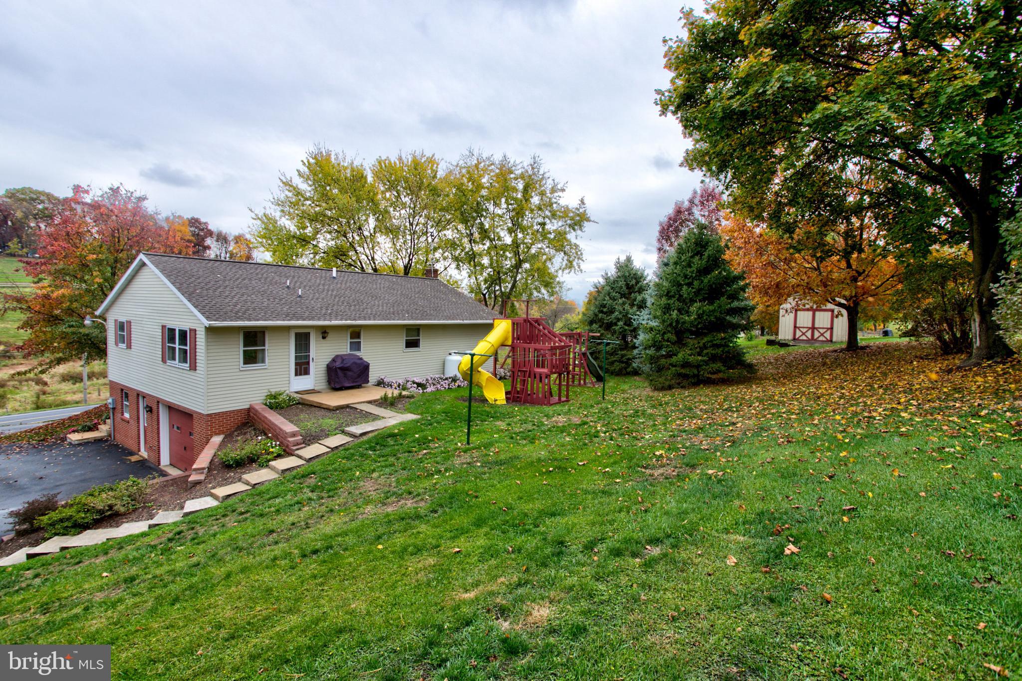 545 Doe Run Road Manheim, PA 17545 - Photo 40 of 47 a front view of a house with garden
