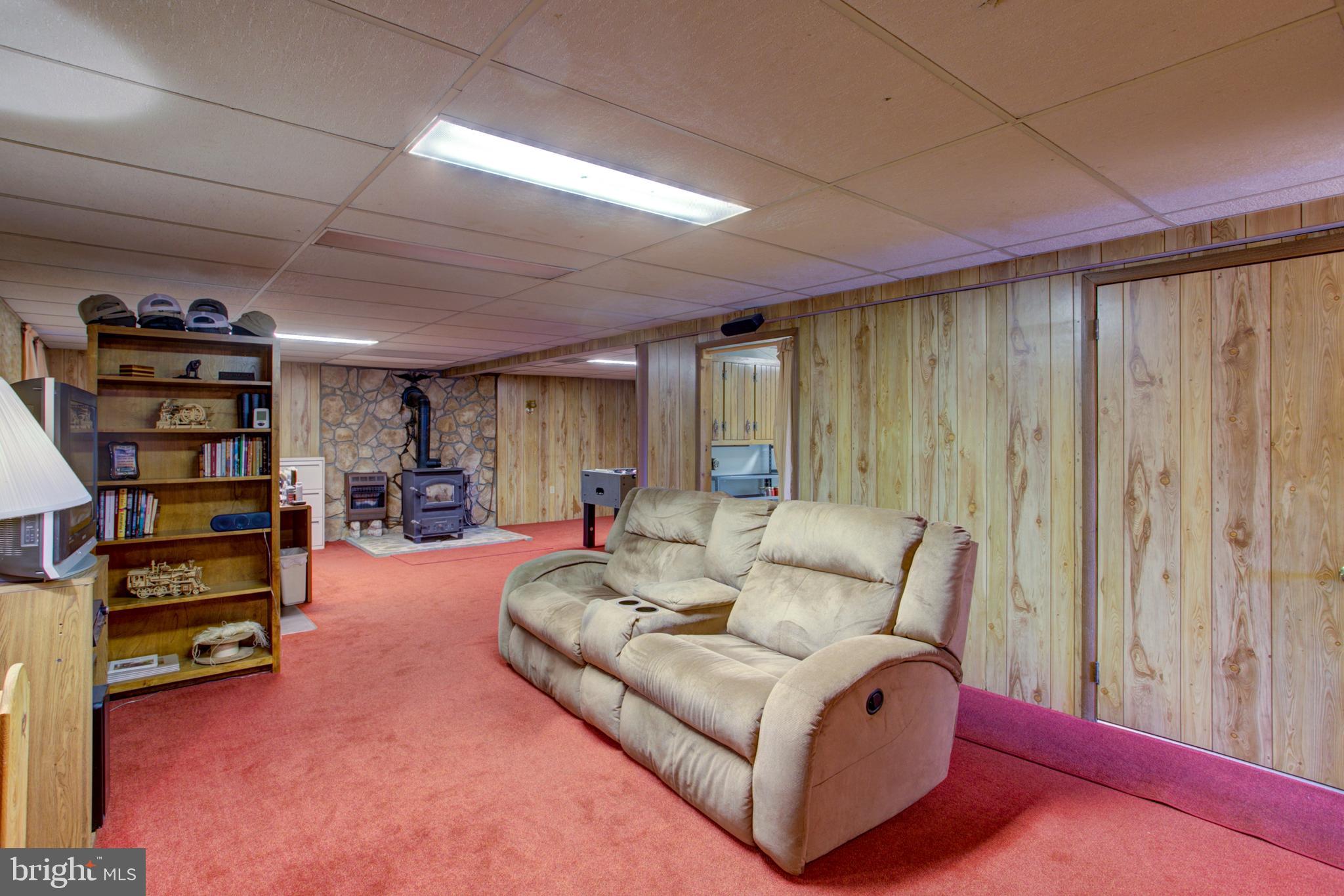 545 Doe Run Road Manheim, PA 17545 - Photo 4 of 47 a living room with furniture and a book shelf