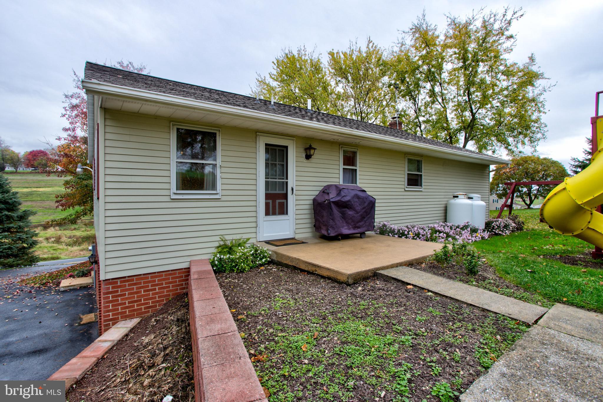 545 Doe Run Road Manheim, PA 17545 - Photo 41 of 47 a view of a backyard with plants and large tree