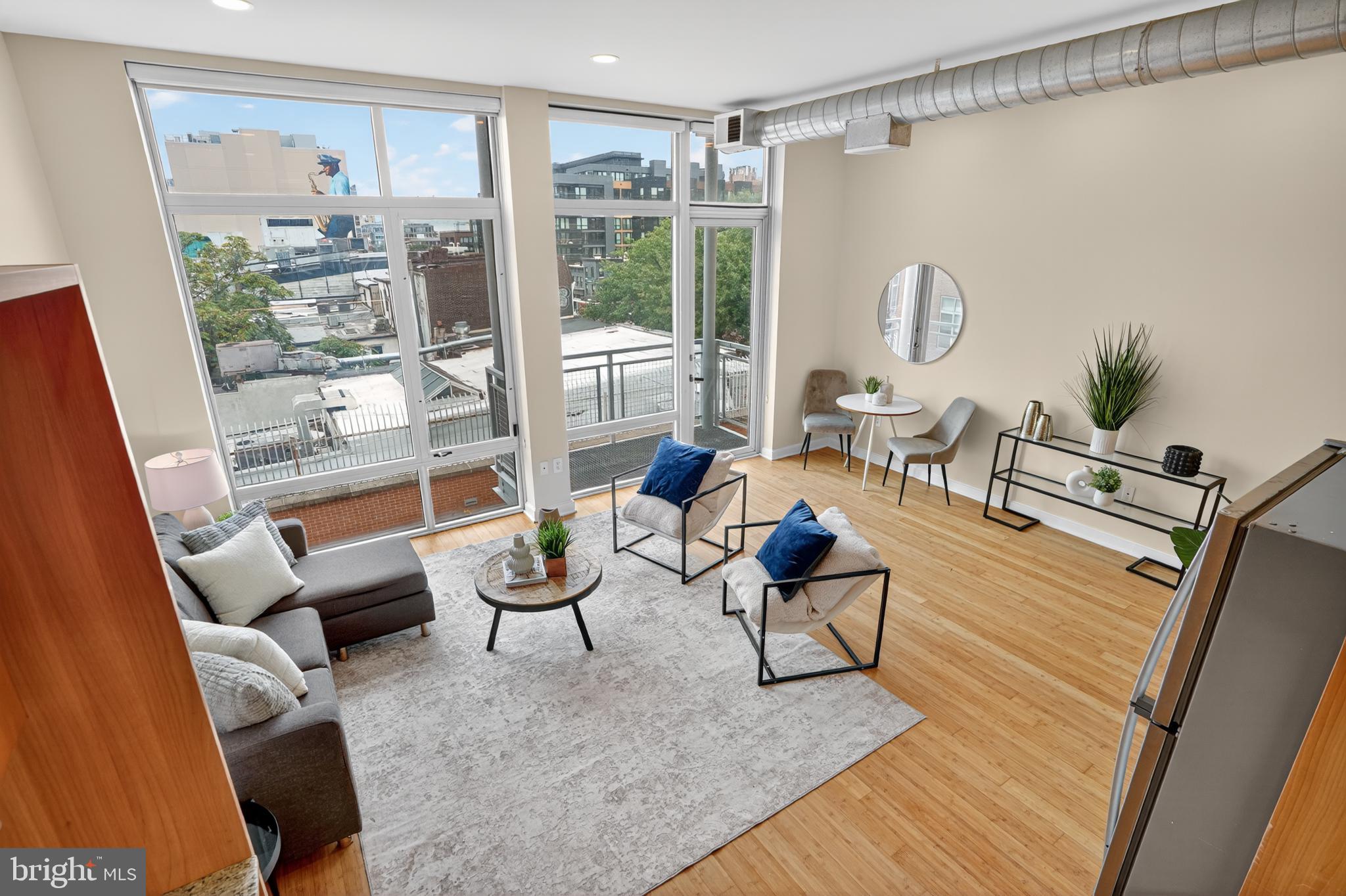 1390 V Street Northwest, Unit 306 Washington, DC 20009 - Photo 11 of 19 a living room with furniture and a floor to ceiling window