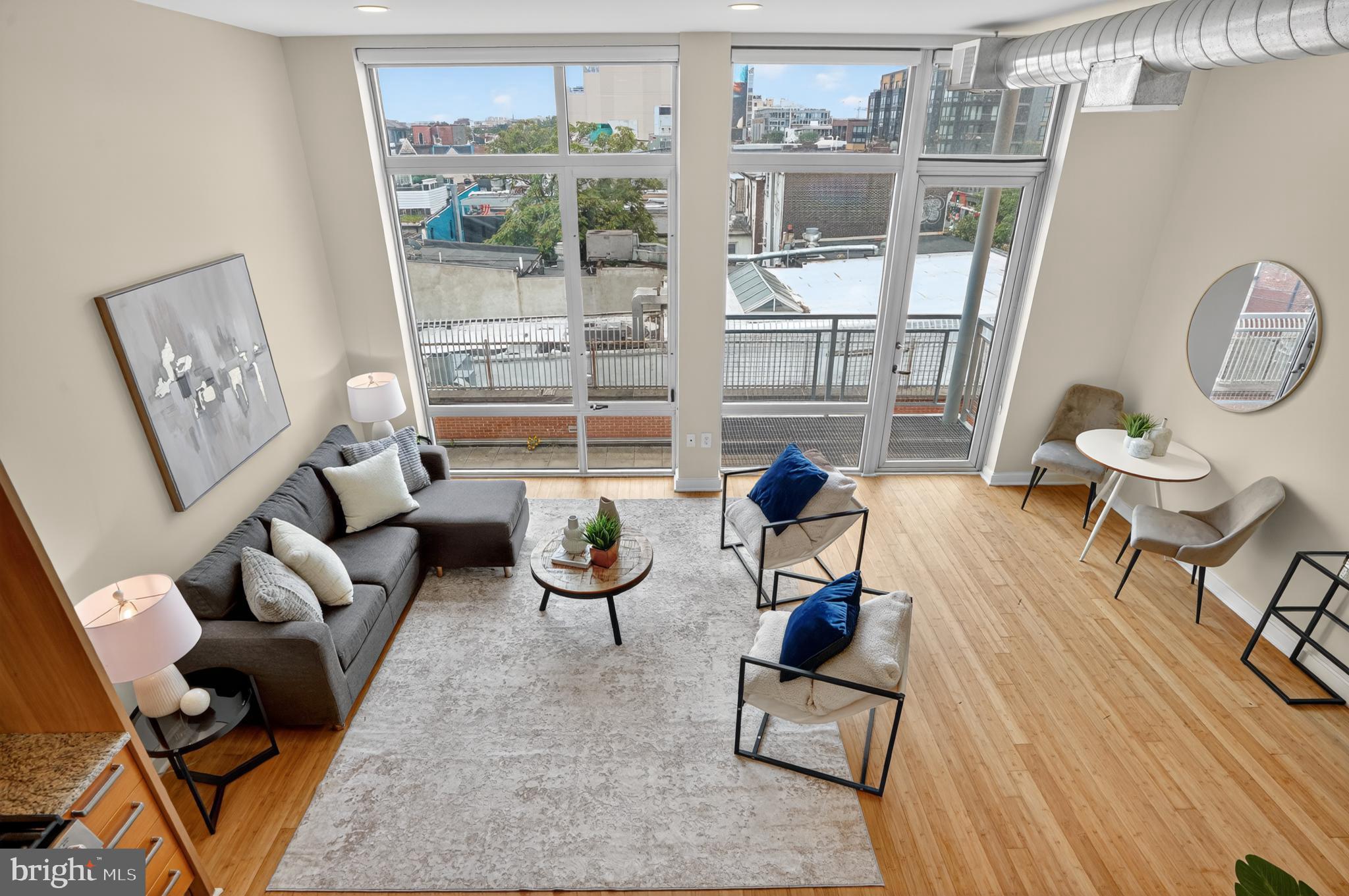 1390 V Street Northwest, Unit 306 Washington, DC 20009 - Photo 12 of 19 a living room with furniture and a large window