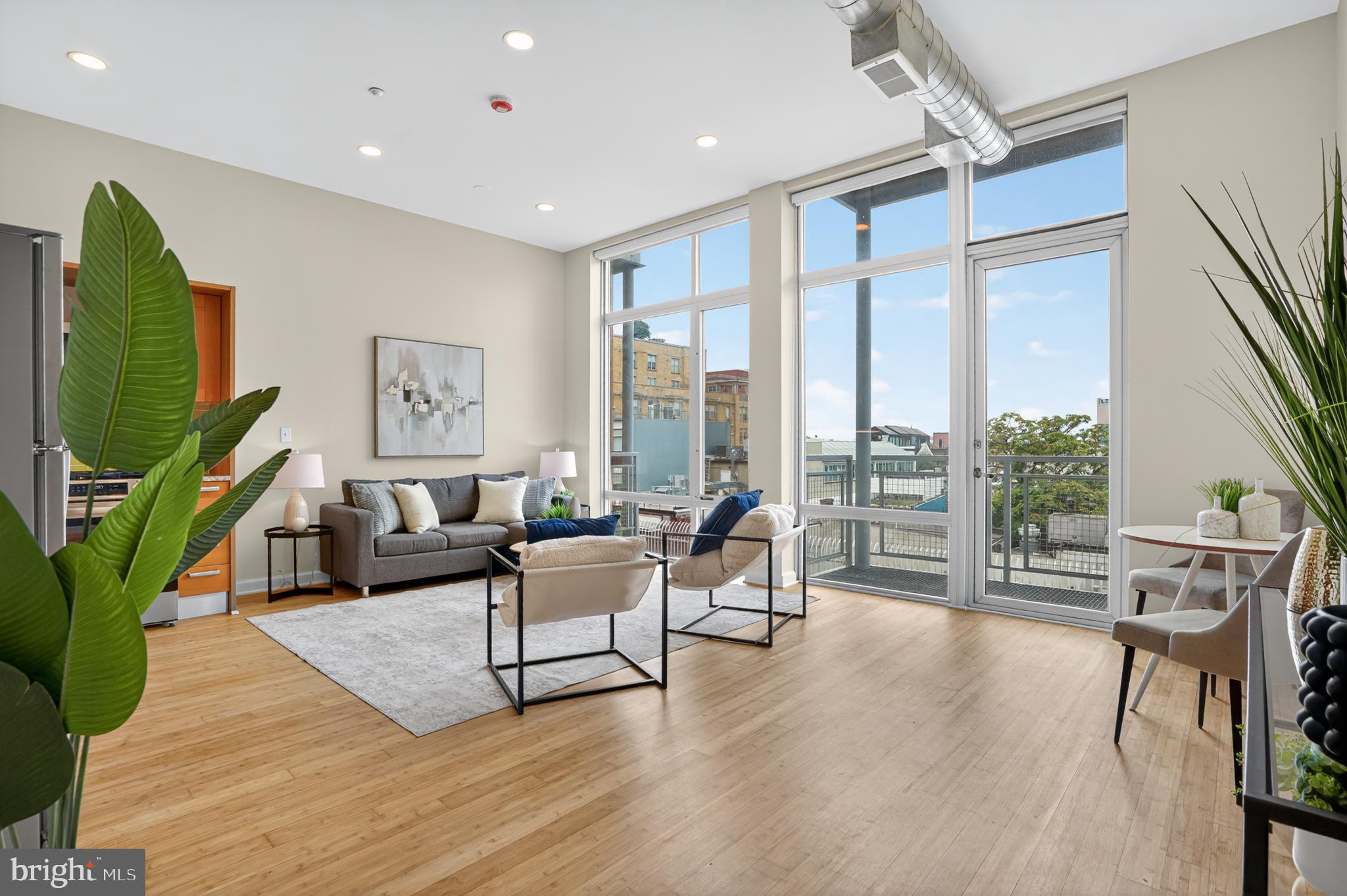 1390 V Street Northwest, Unit 306 Washington, DC 20009 - Photo 13 of 19 a living room with furniture large window and wooden floor