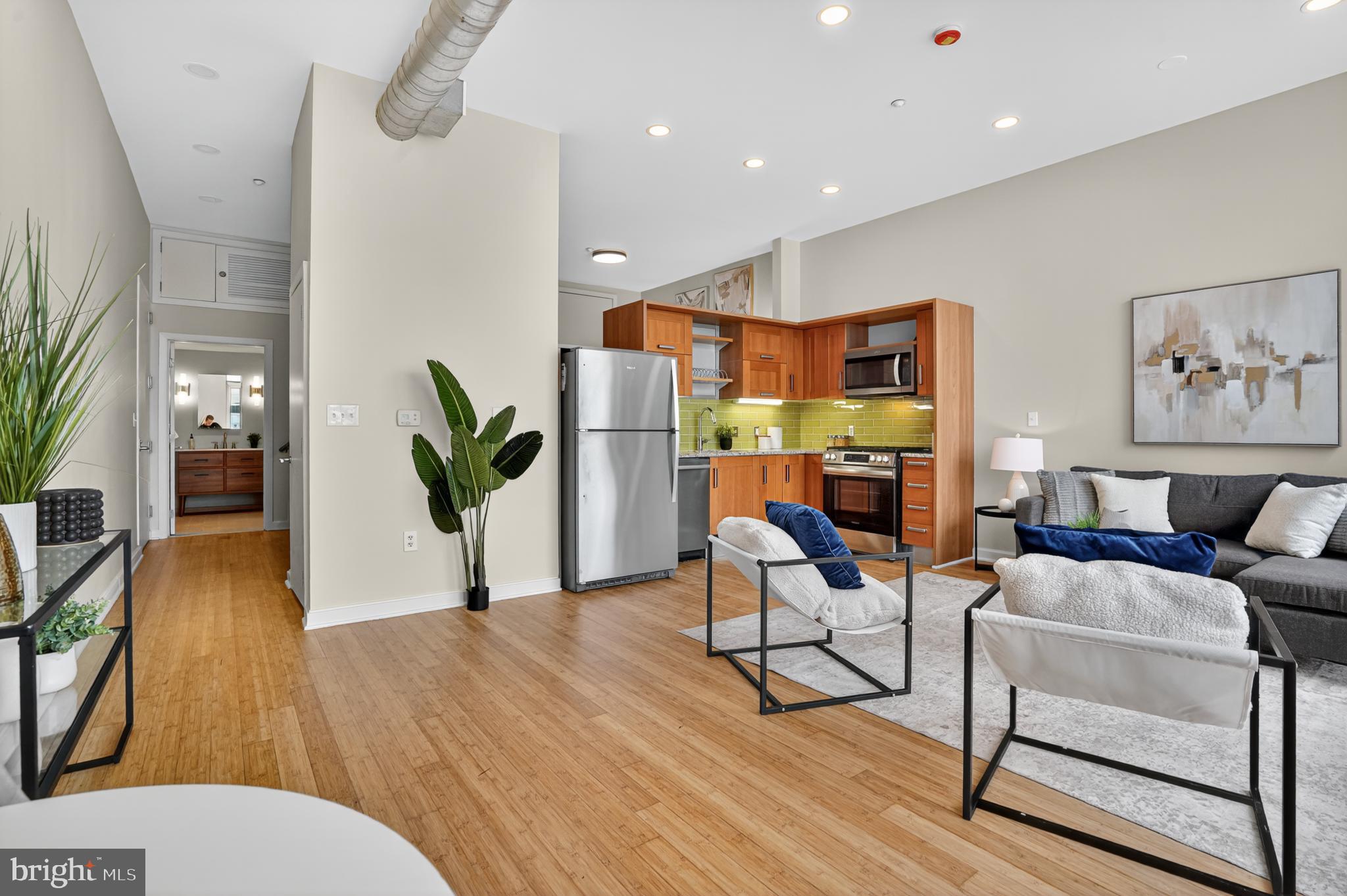 1390 V Street Northwest, Unit 306 Washington, DC 20009 - Photo 15 of 19 a living room with furniture and a wooden floor