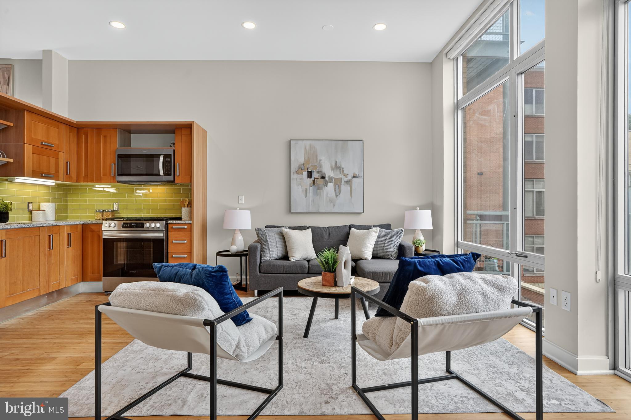1390 V Street Northwest, Unit 306 Washington, DC 20009 - Photo 17 of 19 a living room with furniture kitchen view and a large window