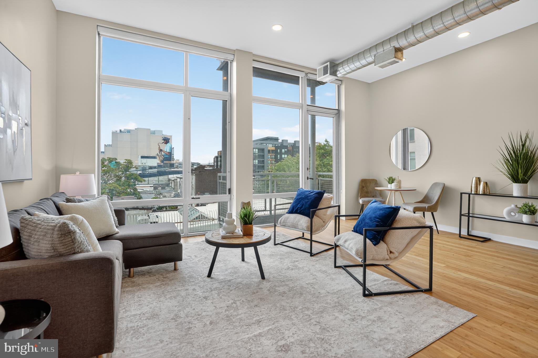 1390 V Street Northwest, Unit 306 Washington, DC 20009 - Photo 3 of 19 a living room with furniture and a large window