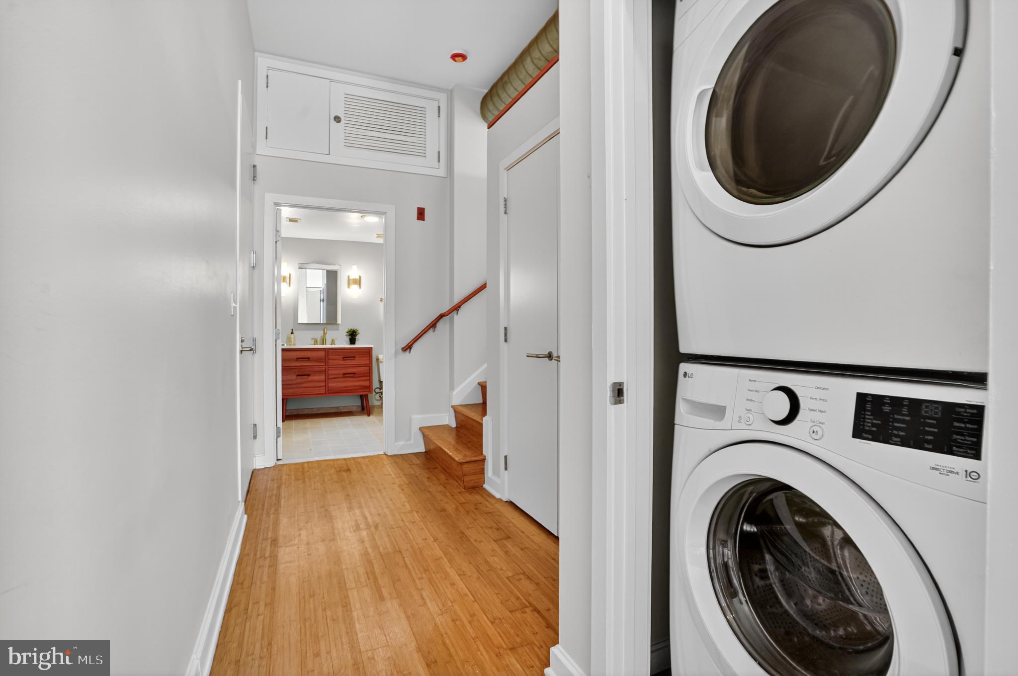1390 V Street Northwest, Unit 306 Washington, DC 20009 - Photo 4 of 19 a view of a hallway with washer and dryer